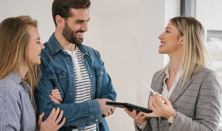 Estate agent showing buyers round