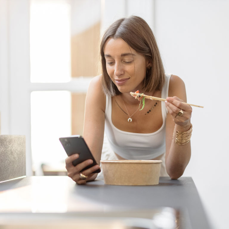 Lady on phone in kitchen